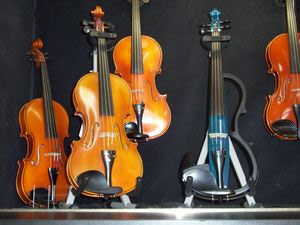 large selection of violins and electric violins